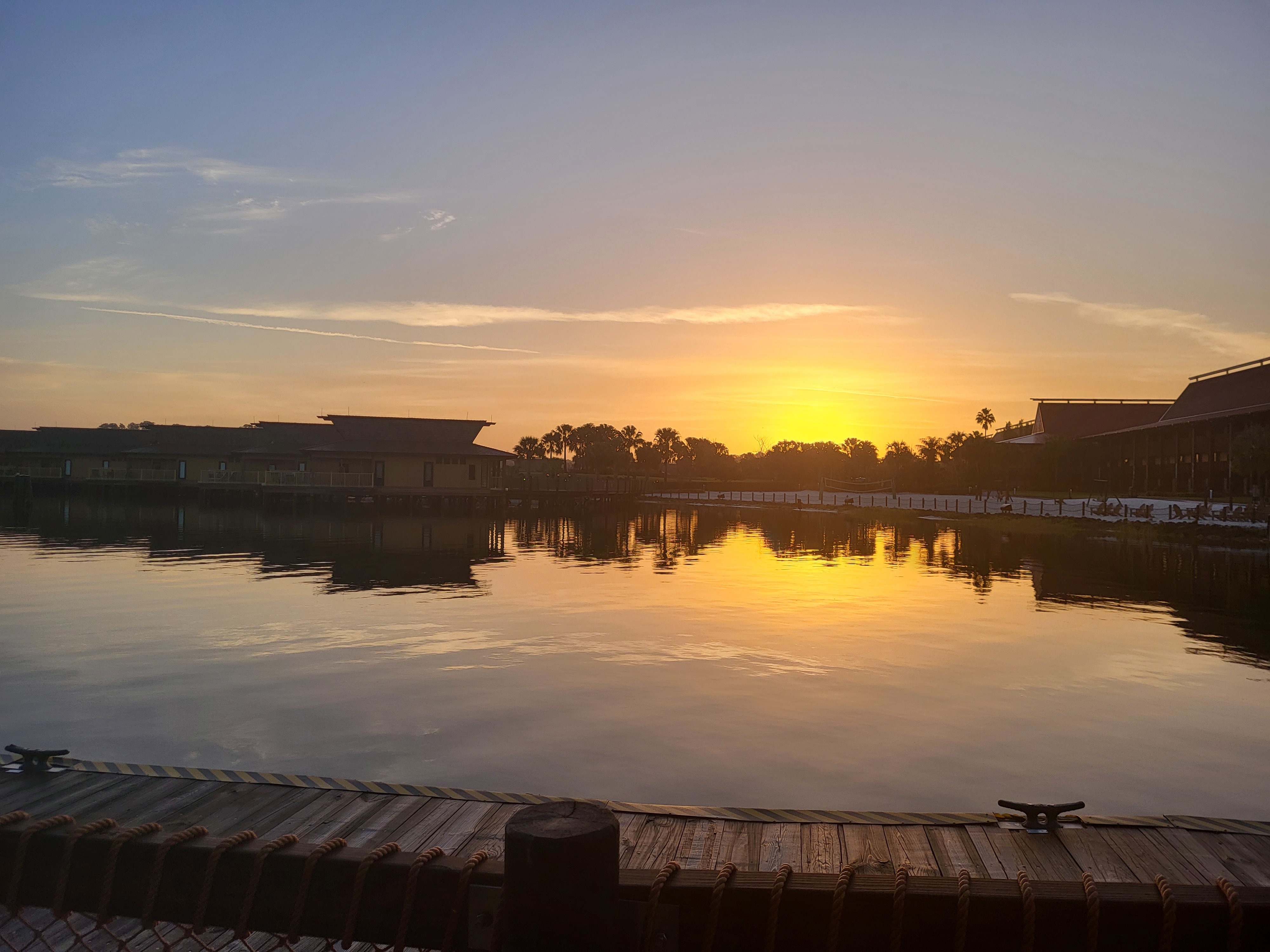 The dock at Disney's Polynesian Resort at sunrise.